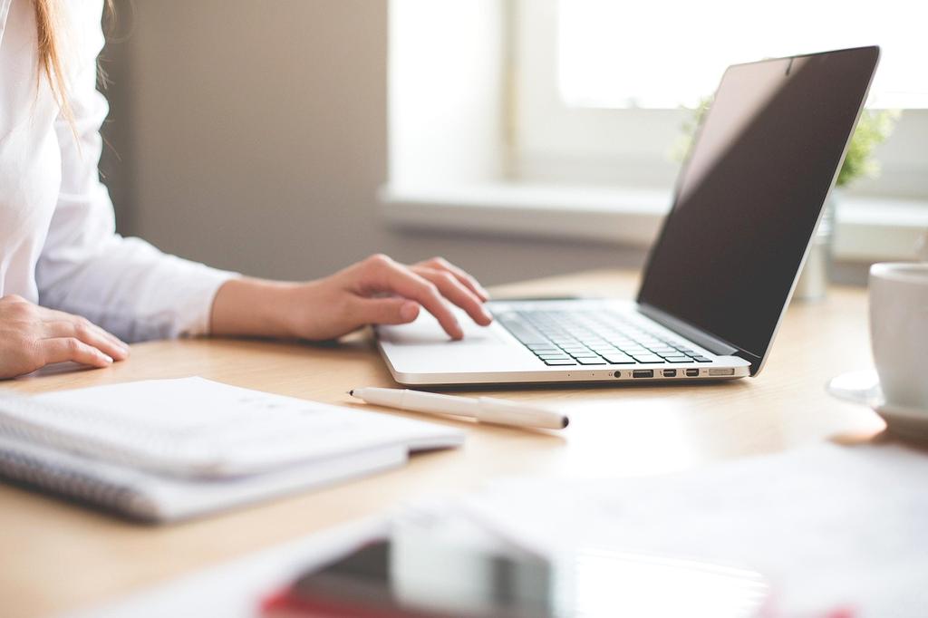Person starting a blog on a laptop